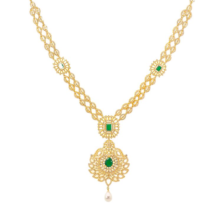 Our Jaya Jewelry set is simply breathtaking. The 22k yellow gold design is decorated with a stunning arrangement of emeralds, cubic zirconia stones, and pearls. It's the perfect 22k yellow gold Indian bridal necklace set for a blushing bride who wants to shimmer and shine with radiance on her special day. Features: • 22k yellow gold • Emeralds • Cubic Zirconia • PearlsThe Indian bridal jewelry collection from Virani Jewelers features a dazzling assortment of precious gemstones, pearls, and of co Elegant 22k Gold Emerald Necklace For Celebration, Elegant 22k Gold Kundan Necklace For Anniversary, Gold Gemstone Necklace For Wedding, Elegant Green Emerald Necklace In 22k Gold, Elegant Yellow Gold Emerald Necklace For Festive Occasions, Festive Yellow Gold Emerald Necklace, 22k Gold Emerald Necklace For Festive Occasions, Gold Hallmarked Emerald Necklace For Wedding, Gold Bridal Necklace With Emerald Gemstone