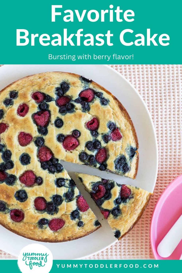 a blueberry and raspberry cake on a white plate with the words favorite breakfast cake