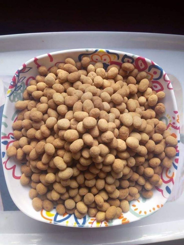 a bowl filled with lots of food on top of a table