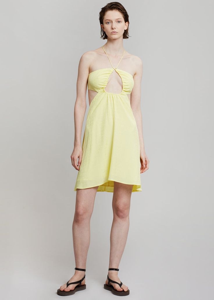 Color: Elfin Yellow Woven jersey with stretch Relaxed silhouette Mini length Halter neck spaghetti straps ties Cut out detail waist to back Tie straps on back 100% Viscose Machine Wash By ROTATE Birger Christensen. Imported Model is 179cm/5'10" wearing a size 36DK/4US Spring Backless Dress With Strappy Back, Strappy Halter Dress With Tie Back For Summer, Strapless Backless Dress With Tie Back For Summer, Spring Halter Neck Mini Dress With Straps, Yellow Backless Summer Dress, Sundress Halter Dress With Tie Back And Spaghetti Straps, Halter Neck Mini Dress With Crisscross Straps For Brunch, Tie Back Halter Sundress With Spaghetti Straps, Brunch Mini Dress With Crisscross Straps And Halter Neck