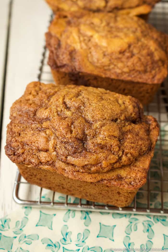 three muffins sitting on top of a cooling rack