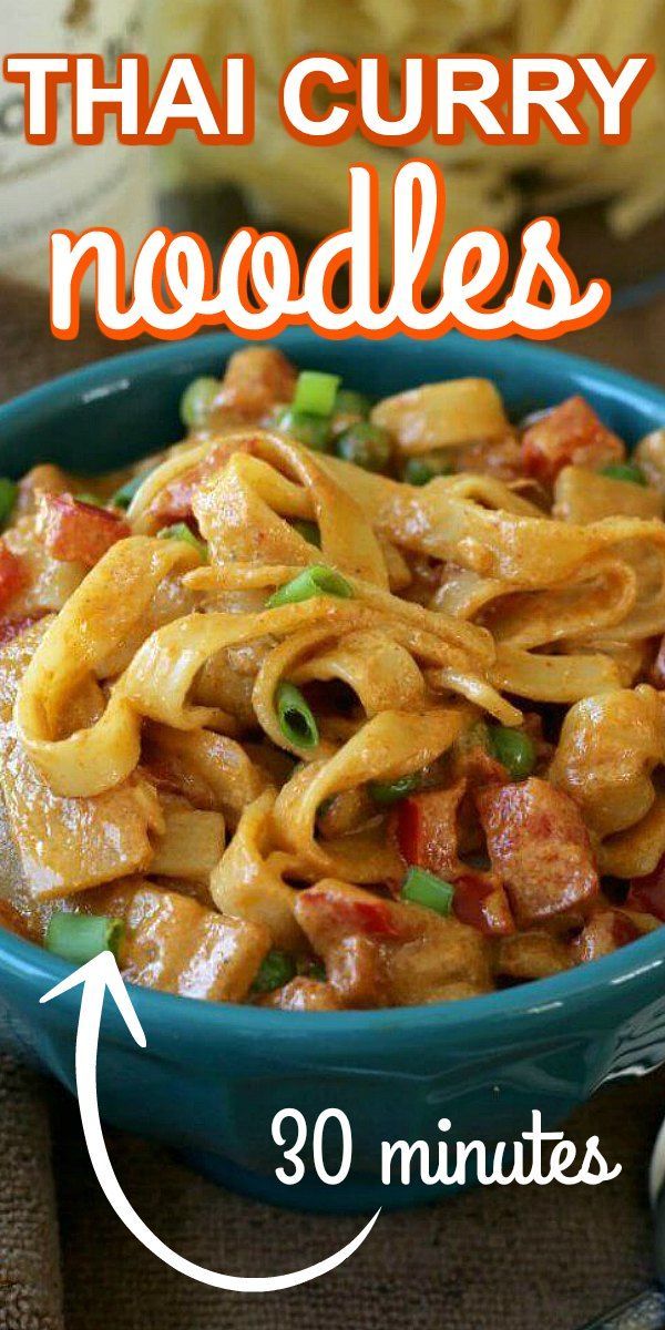 a blue bowl filled with noodles and meat