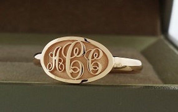 Monogram ring made in solid 14k gold. Provide your initials in order from left to right in the notes section during checkout or through ask me a question. 1.Material - 14K solid gold (585) 2.Stone - none. 3.Dimension - top of ring is approximately 13x8 mm 4.Ring size - contact me for ring sizes not listed in the drop down list. This is made to order and will take about 3 weeks to finish. I use lost wax casting process. Some pictures are professionally computer rendered and the finished product w Modern Rose Gold Jewelry With Initials, Personalized Heirloom Rose Gold Initial Ring, Classic Personalized Rose Gold Initial Ring, Rose Gold Oval Initial Ring Fine Jewelry, Oval Rose Gold Initial Ring Fine Jewelry, Rose Gold Oval Initial Fine Jewelry Ring, Luxury Rose Gold Initial Ring, Fine Jewelry Rose Gold Oval Initial Ring, Engraved Initial Ring In Rose Gold