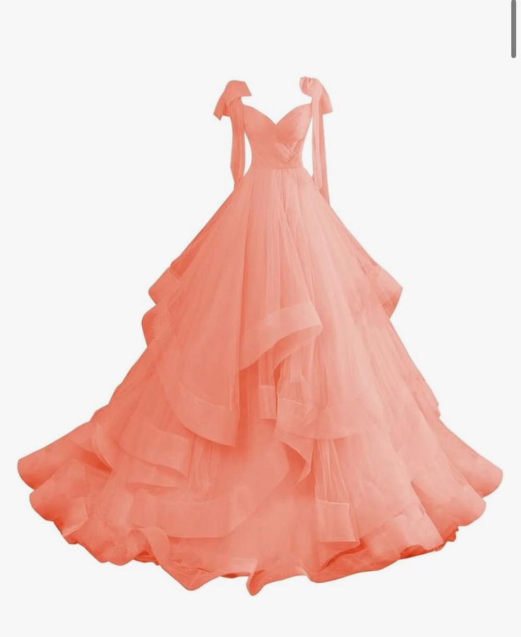 an orange wedding dress on display in front of a white background