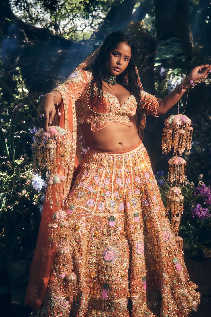 Editor's Note Featuring a 4 piece bridal lehenga set in brick brown velvet embroidered with glass cut beads, metal gold embellishments and 3d appliqué flowers. It is paired with a signature papa don’t preach embroidered butterfly blouse. This look is completed with a brick brown tulle head dupatta embroidered in gold metal embellishments and pearls, and an appliquéd organza velvet side dupatta. Color: Brick brown Fabric: Tulle, organza velvet Sleeve type: Half Neckline: Sweetheart Embroidery det Brown Bridal Lehenga, Blouse Yoke, Metal Embellishments, Butterfly Blouse, Indian Dresses Traditional, Embroidered Butterfly, Indian Bridal Outfits, Gold Embellishment, Brown Velvet