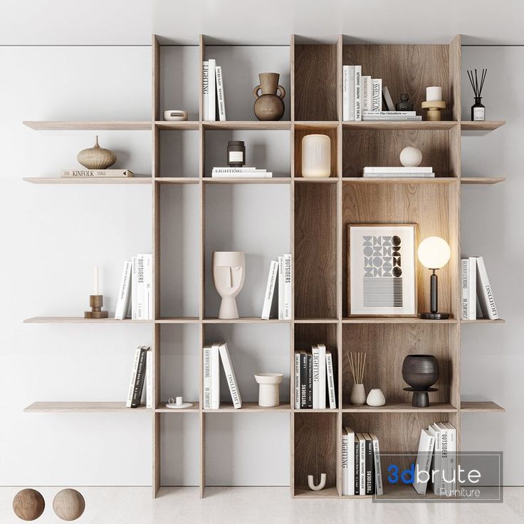 a book shelf filled with lots of books on top of wooden shelves next to a white wall