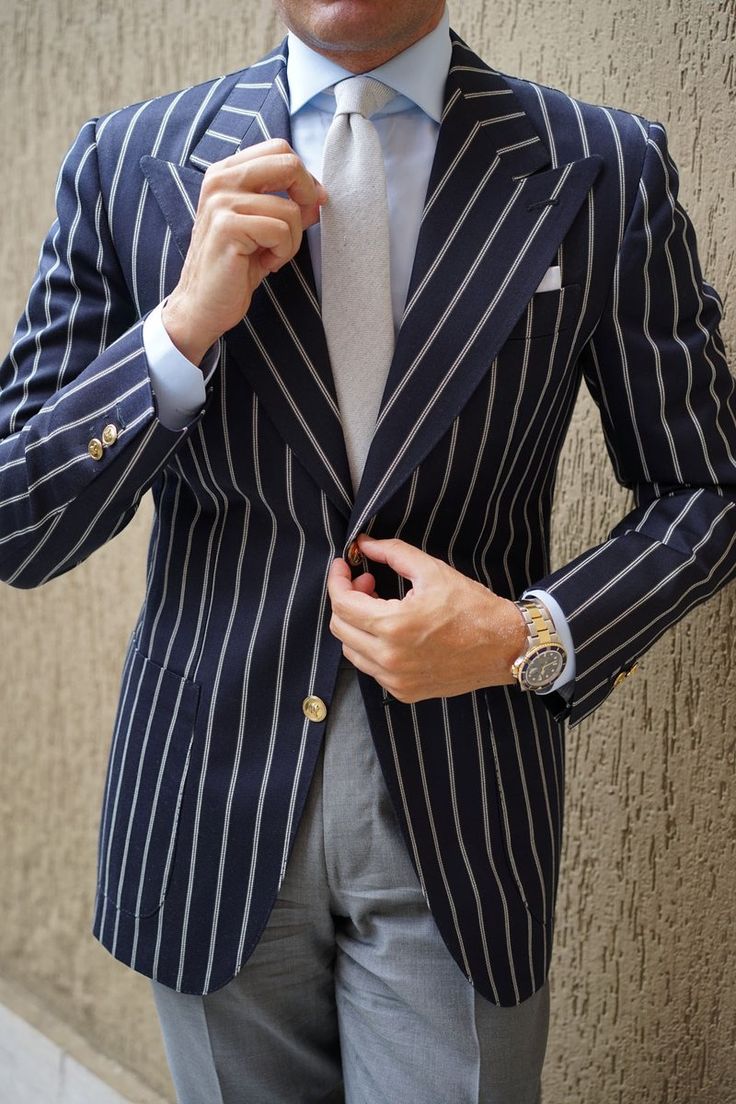 Elegant Striped Notch Lapel Outerwear, Classic Fitted Striped Outerwear, Formal Fitted Striped Outerwear, Elegant Striped Outerwear For Business Casual, Elegant Striped Pattern Outerwear For Business Casual, Classic Striped Formal Outerwear, Classic Striped Outerwear For Formal Occasions, Elegant Slim Fit Blazer For Fall, Elegant Navy Outerwear With Single Button