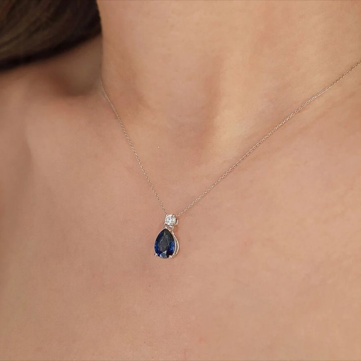 Introducing our exquisite Teardrop Blue Sapphire Solitaire Necklace, a delicate and elegant piece designed for the modern bride. Crafted with meticulous attention to detail, this necklace features a captivating teardrop-shaped blue sapphire, expertly set in a dainty 14K gold pendant. #WomenNecklace #WomenPendant #PearCutNecklace #GemstoneNecklace #DiamondNecklace #SapphireNecklace #DaintyNecklace #MinimalistNecklace #SolitaireNecklace #StatementNecklace #WeddingNecklace #BridalJewelry #GiftHer Blue Teardrop Drop Necklace For Formal Occasions, Formal Blue Teardrop Drop Necklace, Formal Blue Drop Necklace, Elegant Gemstone Drop Necklace For Anniversary, Elegant Blue Teardrop Drop Necklace, Blue Birthstone Necklace For Wedding, Elegant Blue Drop Necklaces, Blue Wedding Birthstone Necklace, Elegant Teardrop Sapphire Necklaces