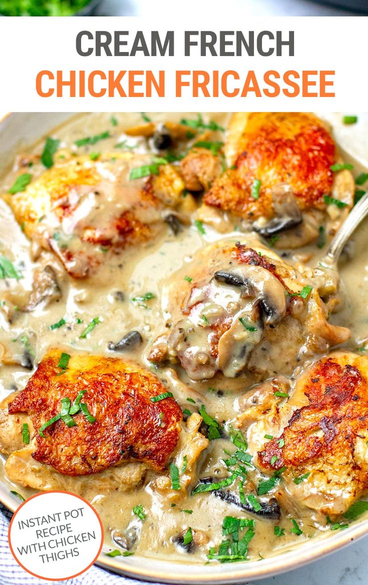 a white bowl filled with chicken and mushroom gravy on top of a table