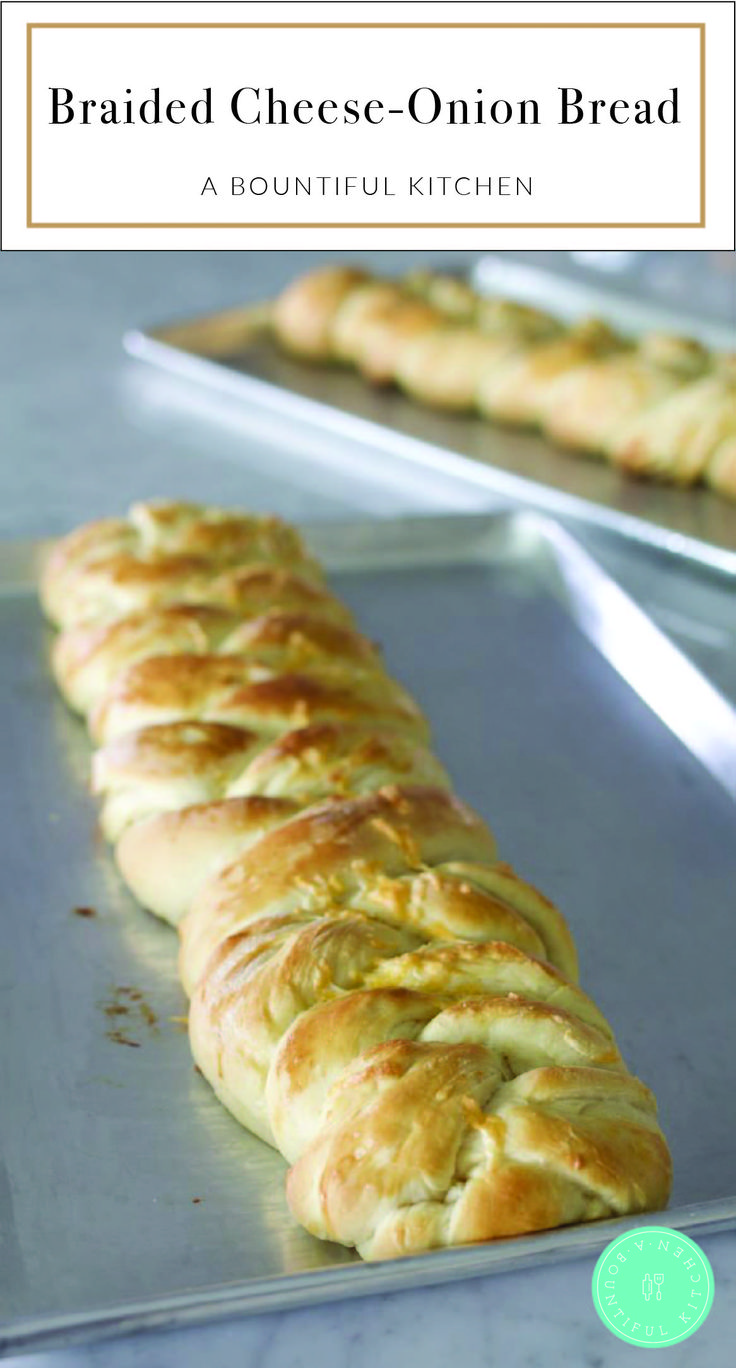 braided cheese - onion bread on a baking sheet with the title text above it