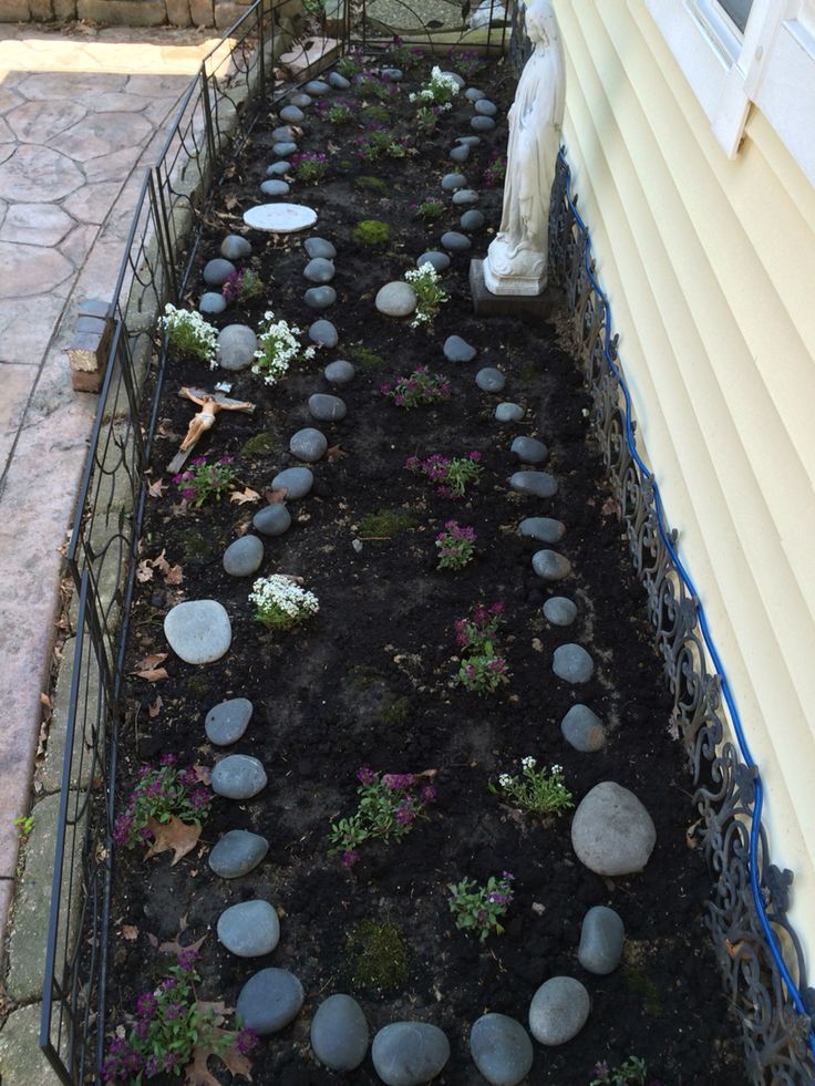 there is a garden with rocks in the ground