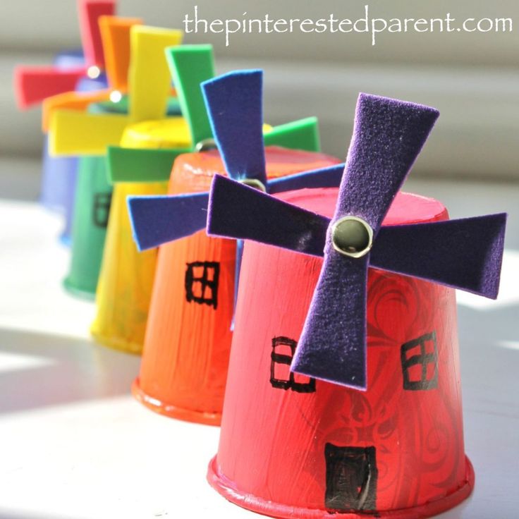 colorful paper windmills sitting on top of a table