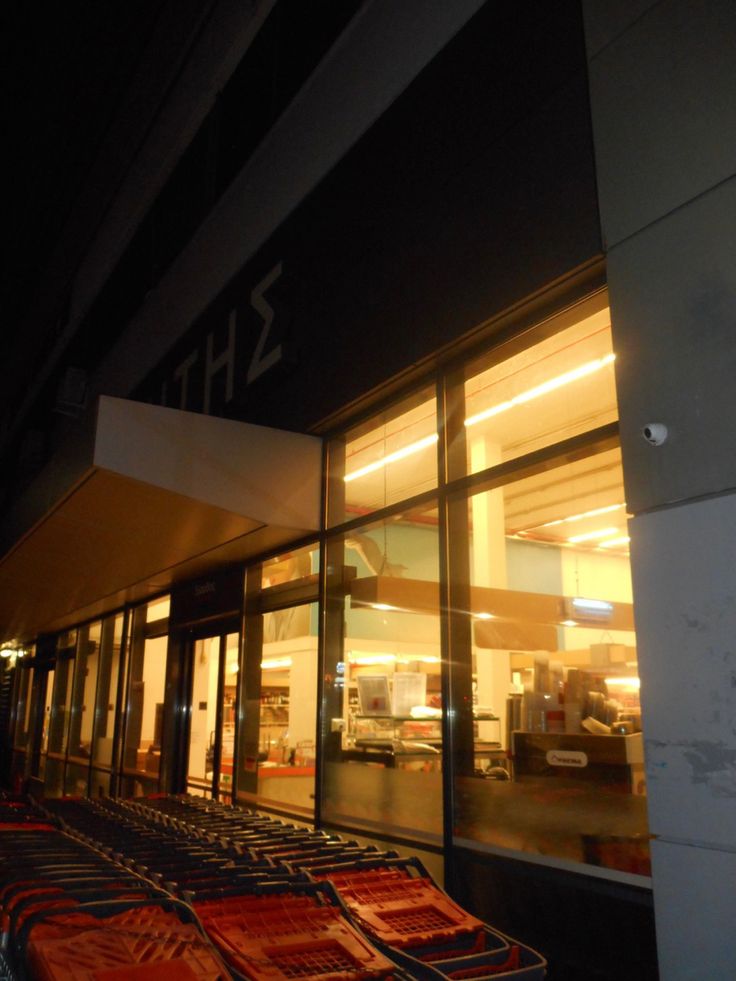 an empty store front at night with the lights on