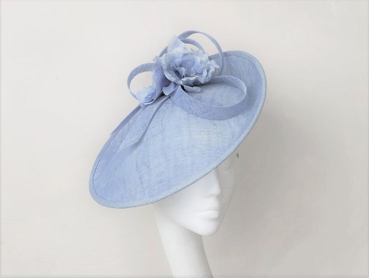 This chic pale blue looped headpiece and silk flowers will make a great addition to any wedding or race day outfit.  Colour can be matched for your requirements.  Free express delivery email rubybosebridal @ gmail .com and I will sort that out for you  through my website Handmade using the highest quality materials.  The disc is approx 36 cm in diam Secured with hairbands in a choice of colours to blend your hair colour. Each piece is handmade by me, for you, using the highest quality materials which takes about 5 days. If you have a specific date you need the headpiece please get in touch and I will ensure you receive in good time. If you would like the piece to be made to match your outfit, or adapted please contact me (a swatch can be sent or matched to your required colour) Presented i Diy Derby Hat Ideas, Diy Kentucky Derby Hat, Hat Wedding Guest, Cornflower Blue Wedding, Fascinator Hats Diy, Pale Blue Dresses, Blue Fascinator, Race Day Outfits, Ascot Hats