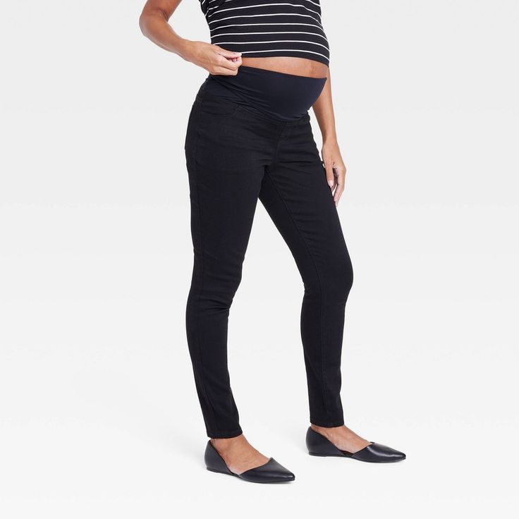 Give your casual maternity wardrobe a comfy, stylish upgrade with these Over Belly Skinny Maternity Pants from Isabel Maternity by Ingrid & Isabel™. The black skinny pants are crafted from soft fabric with a hint of spandex that keeps you moving through the day in absolute comfort. The full-elastic waistband and over-belly panel accommodate your growing bump, while front and back pockets lend added convenience. Stretch Black Maternity Pants, Black Stretch Maternity Pants, Stretch Black Maternity Bottoms, Black Stretch Maternity Bottoms, Stretch Black Bottoms For Maternity Wear, Bump Friendly Maternity Bottoms With Straight Leg, Maternity Straight Leg Bottoms, Bump-friendly Straight Leg Maternity Bottoms, Bump Friendly Straight Leg Maternity Bottoms