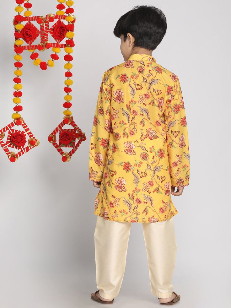 VASTRAMAY Boys' Multicolor-Base-Mustard And Cream Kurta Pyjama Set This stylish VASTRAMAY Boys' Kurta Pyjama Set features a multicolor-base with mustard and cream accents, making it perfect for festive occasions and family gatherings. Comfortable and elegant, this set is designed to keep your little one looking dapper and feeling at ease all day long. Features Elegant multicolor-base with mustard and cream accents Comfortable fit for all-day wear Perfect for festive occasions and family gatherin Yellow Cotton Long Sleeve Sets, Traditional Orange Sets For Spring, Casual Festive Sets For Diwali, Long Sleeve Yellow Kurta For Eid, Yellow Long Sleeve Kurta For Eid, Long Sleeve Yellow Kurta For Summer, Casual Yellow Sets For Eid, Casual Long Sleeve Yellow Kurta, Yellow Long Sleeve Summer Kurta