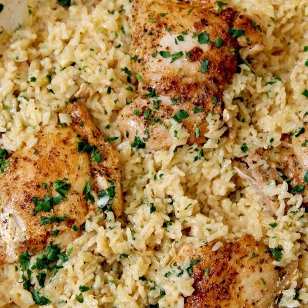 chicken and rice dish with parsley on top