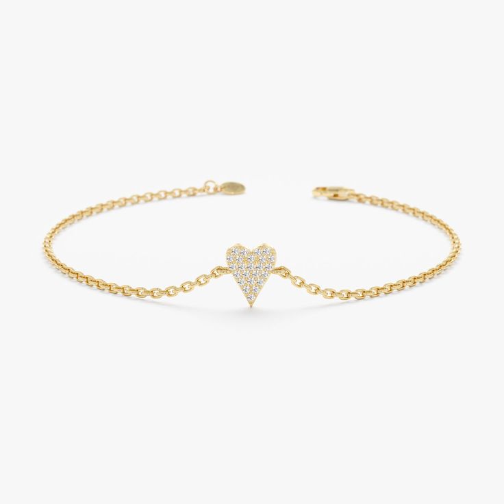 Add a touch of timeless love and sophistication to your wrist with the Elongated Diamond Heart Bracelet. This beautiful piece showcases a delicate 14k yellow gold chain adorned with a stunning elongated heart pendant. The center of the heart features sparkling pave diamonds, meticulously set to create a brilliant display of shimmer. - Handmade - Solid Gold - Natural Diamond  - G Color, SI Quality Diamonds - Total Diamond Carat Weight: 0.08 ctw - Dimensions of the Heart: 5 x 7 mm 🛠 Your Sarah Elise piece is handcrafted with care! Ready-to-ship items go out within 3 business days. Made-to-order pieces typically take 7-10 business days to create. If you need something sooner, please contact us - we'll see if we can make it happen! For estimated shipping dates and tracking, check your Etsy ac Luxury Adjustable Heart Bracelet, White Gold Heart Diamond Bracelet For Valentine's Day, Heart-shaped White Gold Diamond Bracelet For Valentine's Day, Elegant White Gold Heart Pendant Bracelet, Elegant Open Heart Bracelets, Elegant Open Heart Bracelets For Everyday, Elegant Open Heart Bracelets For Mother's Day, Valentine's Day White Gold Heart Diamond Bracelet, Valentine's Day Heart-shaped White Gold Diamond Bracelet