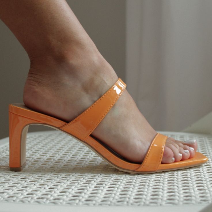 Be Sure To Turn Heads In This Sleek Bright And Bold Pair. A Square, Open Toe Complements The Double Strap And Shaved Half-Moon Block Heel, Making A Striking Style Statement. 3" Heel Rubber Sole Has Nonskid Markings Manmade Materials Imported Elegant Orange Sandals For Summer, Orange Summer Heels With Heel Loop, Summer Orange Heels With Heel Loop, Fitted Slip-on Mules For Summer, Summer Slip-on Heels With Heel Loop, Summer Orange Heels With Heel Strap, Orange Heels With Heel Strap For Summer, Orange Open Heel Mules For Spring, Orange Summer Heels