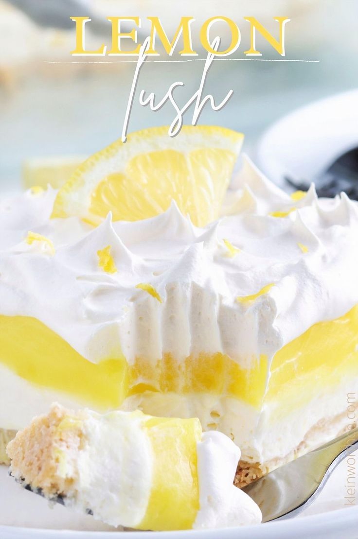 a close up of a plate of food with lemon and whipped cream frosting on it