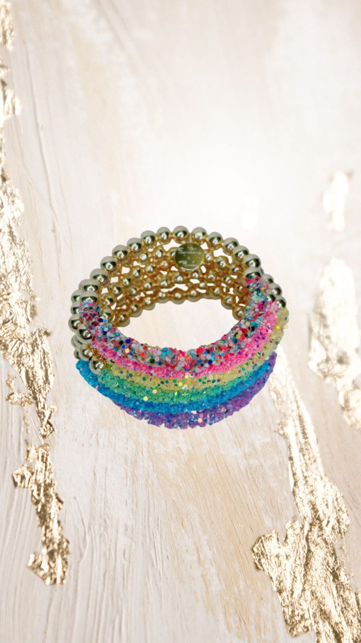 "Add some sparkle to your wrist with these gorgeous glittery bracelets. Glitter stays on and won't mess up!  Choose your favorite from the drop down menu.  **Please note the shipping time. This specific bracelet is a pre order, which means it will take anywhere between 1 to 2 weeks to arrive. To ensure a proper size, use a tape measure around your wrist. Place a dot where the tape measure meets. That is your wrist size! In our drop down menu, we have also included the average sizes for you. Plea Sparkling Adjustable Beaded Bracelets As Gift, Adjustable Sparkling Beaded Bracelet For Gift, Adjustable Sparkling Beaded Bracelets As Gift, Adjustable Gold Jewelry With Glitter, Adjustable Gold Jewelry With Glitter Details, Trendy Adjustable Bling Bracelet, Adjustable Sparkling Beaded Bracelets For Parties, Adjustable Sparkling Beaded Bracelet For Party, Trendy Beaded Crystal Bracelet For Party