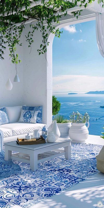 an outdoor living area with blue and white decor on the walls, furniture and plants