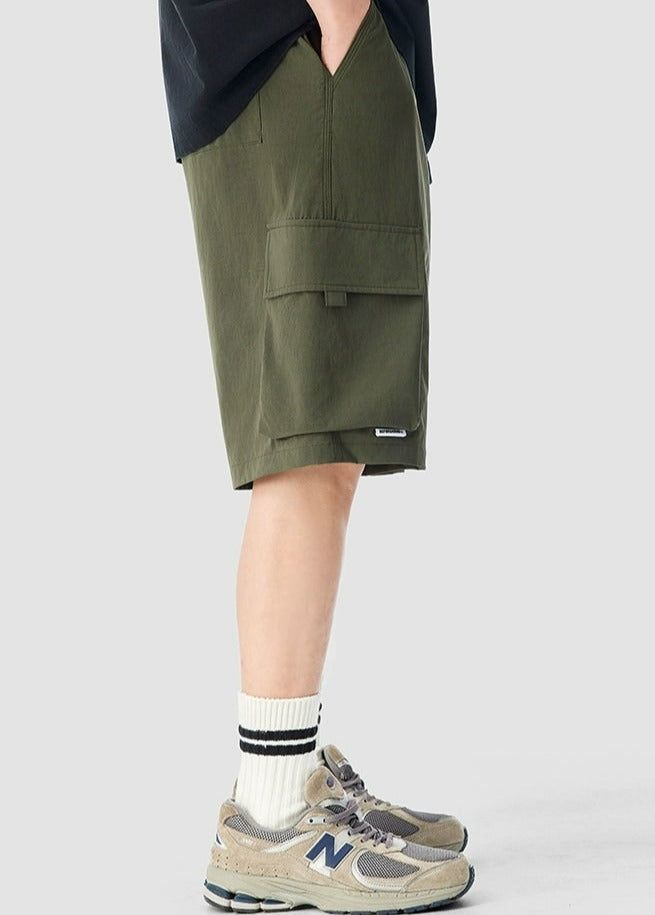 Experience functionality and style with our Cargo Utility Shorts, complete with a zippered pocket for the modern man on the go. 

Crafted from a breathable blend of 90% nylon and 10% spandex, these shorts feature a low waist, loose straight fit, and ice silk quick-drying properties for ultimate comfort. The edgy design includes a durable dual-duty stitch, ample storage with a large utility pocket, and a classic straight-cut hem for a relaxed silhouette. Versatile and comfortable, these shorts ar Shorts Cargo, Modern Man, Army Green, Zipper, How To Wear