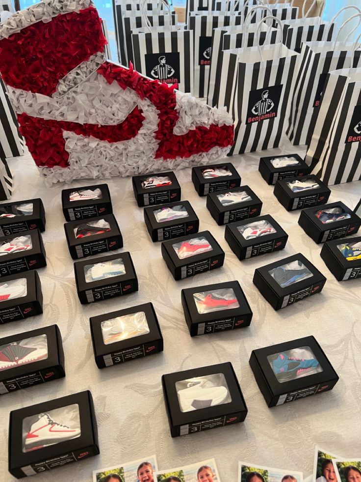 a table topped with black boxes filled with pictures