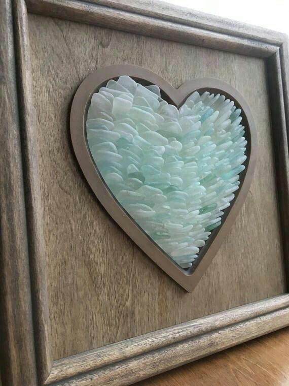 a wooden frame with a heart cut out of it