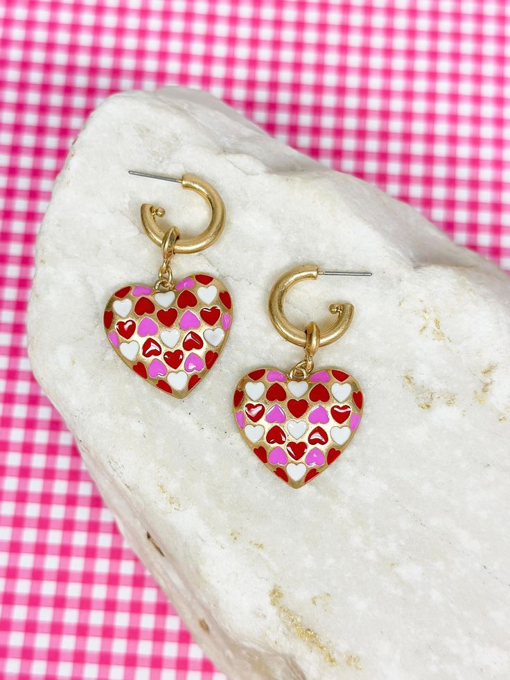 Our limited-edition curated Valentine earrings offer fun-loving designs, to stylishly carry you through the loving season. These make a great gift as well! Enamel Material & Base Metal with Worn Gold Plating 1.7" Length Trendy Dangle Heart Earrings For Valentine's Day, Trendy Earrings For Valentine's Day Gift, Trendy Valentine's Day Earrings For Gift, Trendy Valentine's Day Gift Earrings, Trendy Heart Earrings For Valentine's Day, Trendy Small Hoop Earrings For Valentine's Day, Trendy Heart Charm Earrings For Valentine's Day, Trendy Heart-shaped Hoop Earrings For Valentine's Day, Trendy Nickel-free Hoop Earrings For Valentine's Day