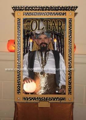 an image of a man with a beard in front of a halloween photo frame that says zoltar