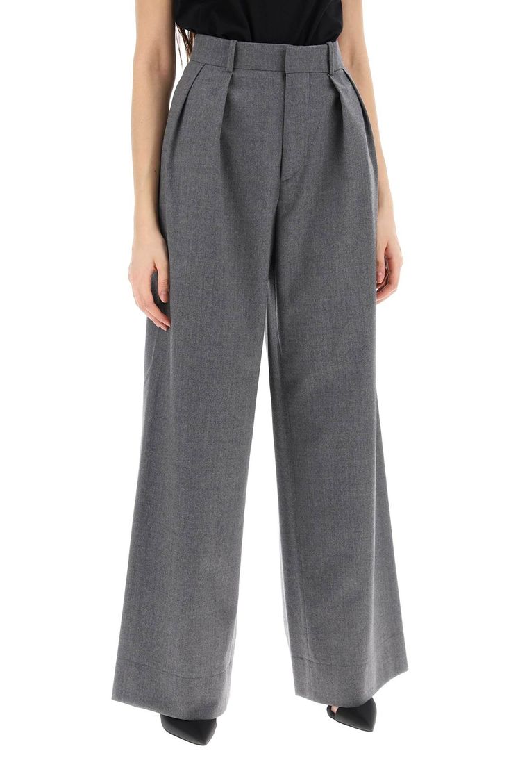 These pants are like the classy, laid-back friend everyone wants—easy-going, yet undeniably sharp. Made from pure virgin wool flannel, they promise comfort with a touch of elegance that doesn't try too hard. It's all about that effortlessly cool vibe. Wide high-waisted cut with front pleats Front zip and hook closure for a secure fit Handy side French pockets and back welt pockets Crafted from 100% virgin wool Made in Slovakia Color: Grey Flannel Trousers, Wardrobe Nyc, Wool Flannel, Heron Preston, Welt Pockets, Charcoal Grey, Capsule Wardrobe, Jacket Dress, Dress To Impress