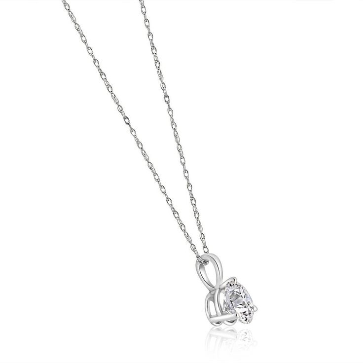 This classic solitaire pendant features one round brilliant cut moissanite stone. The stone is prong set in a 14k white gold setting. An 18" 14k white gold clasp lock chain is included. Floating Heart Necklace, Lock Chain, Solitaire Diamond Pendant, Solitaire Pendant Necklace, Ring Chain, Boot Jewelry, Round Pendant Necklace, Initial Pendant Necklace, Solitaire Pendant