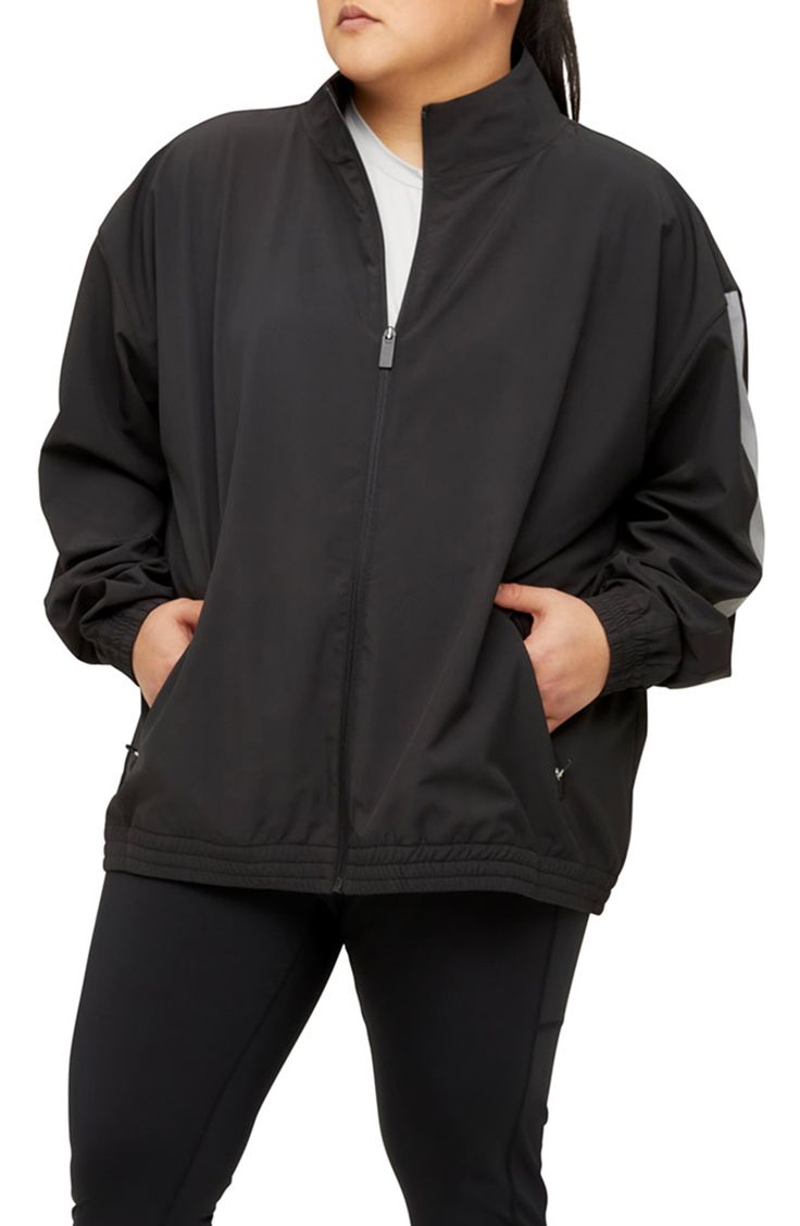 A back vent adds breathability to a sporty jacket complete with reflective stripes on the sleeves. Stand collar   90% recycled polyester, 10% spandex   Hand wash, line dry   Imported Black Stretch Track Jacket For Outdoor Activities, Functional Black Outerwear With Go-dry Technology, Functional Black Go-dry Outerwear, Black Breathable Athleisure Windbreaker, Black Nylon Track Jacket For Training, Reflective Athleisure Track Jacket For Fall, Black Breathable Sporty Outerwear, Technical Sports Windbreaker With Reflective Details, Sporty Long Sleeve Outerwear With Reflective Logo