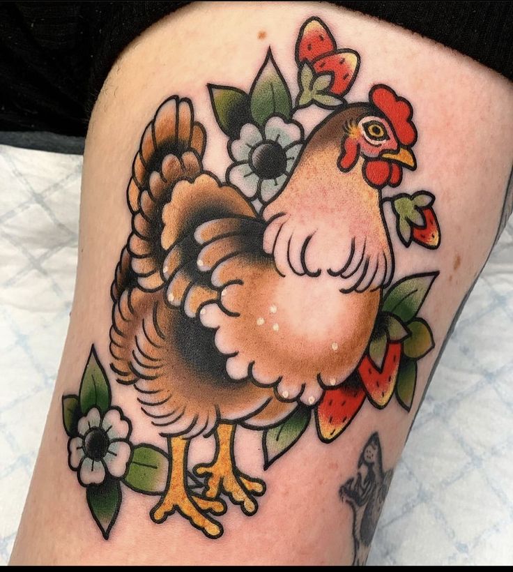 a chicken with flowers on it's leg