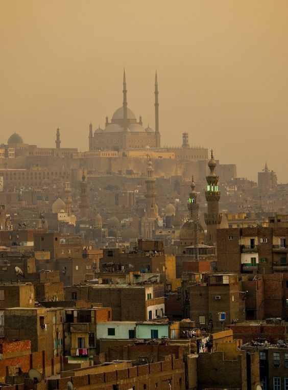 an old city is shown in the distance