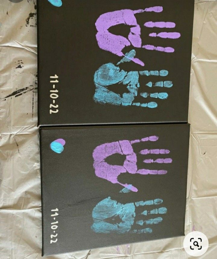 two canvases with hand prints on them