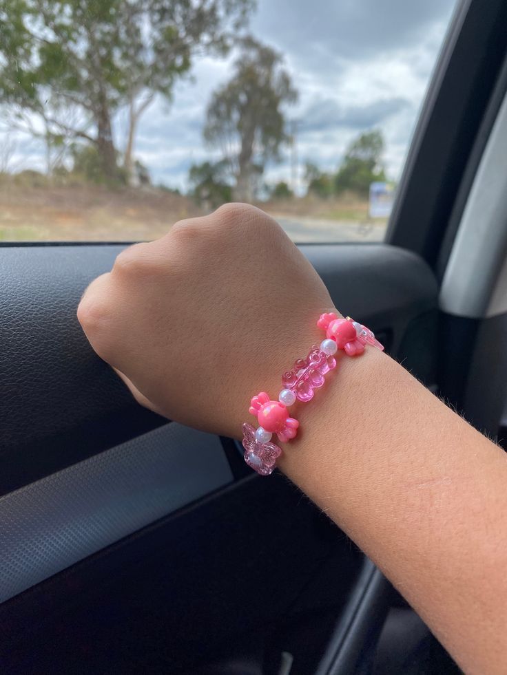 This bracelet has so many different pink and white charms on it! Anyone and i mean ANYONE can wear this bracelet It is very stretchy but please do not over stretch it because it may snap. Thanks for reading this! Pink Wristband With Letter Beads As Gift, Trendy Pink Beaded Charm Bracelet, Adjustable Pink Charm Bracelet With Letter Beads, Pink Adjustable Charm Bracelet For Friendship, Adjustable Pink Wristband With Letter Beads, Cute Pink Wristband With Letter Beads, Handmade Pink Charm Bracelet For Friendship, Cute Pink Beaded Stretch Bracelet, Cute Pink Jewelry With Letter Beads