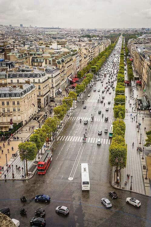 an aerial view of a city street with cars and buses