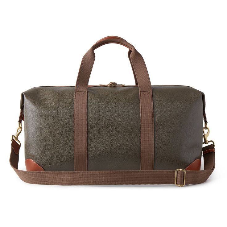 Nothing says 'classic Mulberry' like our Scotchgrain luggage collection. Its beautifully textured surface is accented by smooth leather trim. Travel pieces should be built to last, and look good while doing it. A timeless travel bag in a medium size, this clipper has two short handles and a detachable shoulder strap. Leather trim detailing Two canvas handles with leather detailing Detachable and adjustable canvas shoulder strap Metal feet at the base of bag Detachable luggage tag Internal Mulber Brown Coated Canvas Bag For Business Trips, Classic Coated Canvas Travel Bag For Formal Use, Classic Coated Canvas Travel Bag For Formal Occasions, Classic Formal Travel Bag In Coated Canvas, Classic Leather Luggage With Leather Lining, Classic Business Luggage With Leather Lining, Classic Travel Luggage With Leather Backing, Designer Leather Luggage With Sleeve, Designer Brown Luggage For Business