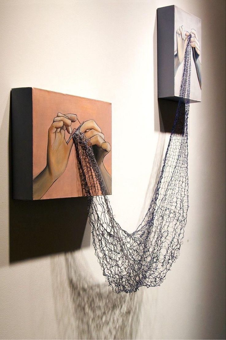 two paintings are hanging on the wall next to each other, one is holding yarn