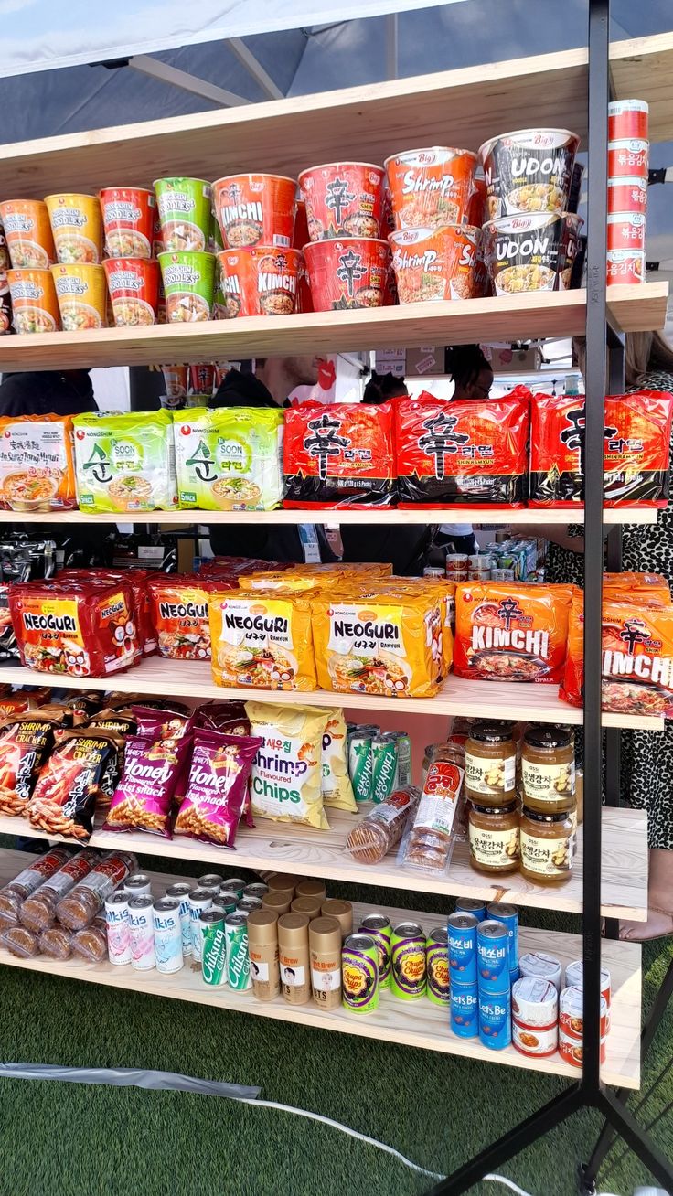 an assortment of food items on display in a grocery store's outdoor market stall