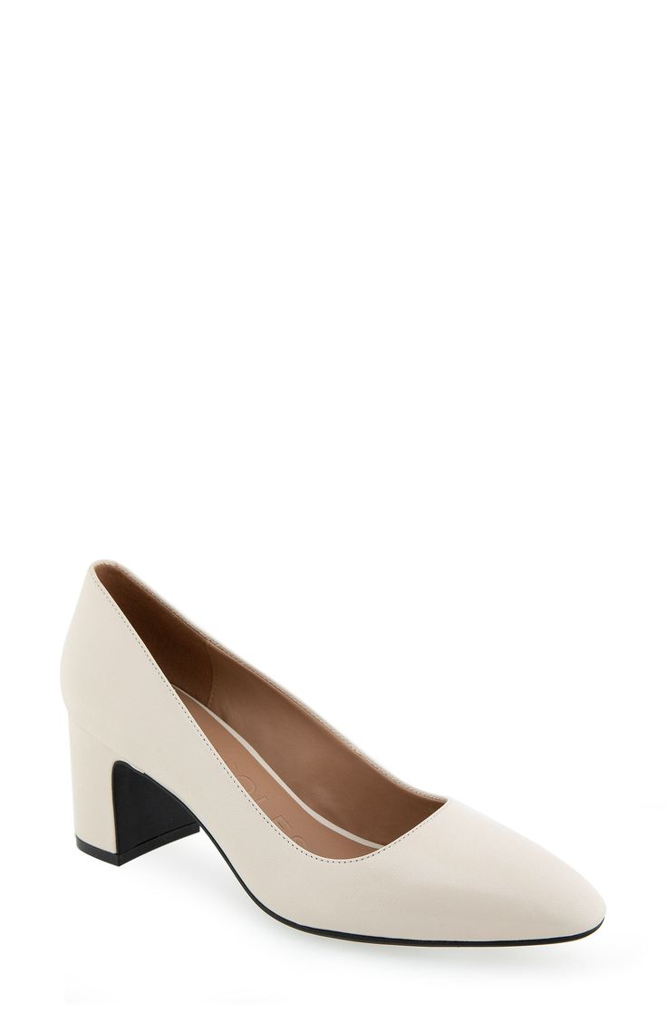 An almond toe defines this classic leather pump elevated by a half-moon block heel and a shock-absorbing sole. Leather upper/synthetic lining and sole Imported Modern Beige Heels With Contrasting Heel Counter, Cream Medium Width Court Shoes For Office, Cream Heels With Reinforced Heel And Medium Width, Cream Heels With Reinforced Heel For Workwear, Cream Heels With Contrasting Heel Counter For Work, Modern Beige Heels With Reinforced Heel, Modern Cream Closed Toe Heels, Cream Court Shoes With Padded Heel And Medium Width, Cream Court Shoes With Sculpted Heel, Medium Width