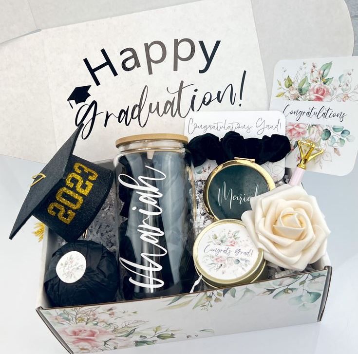 a graduation gift box filled with congratulations items