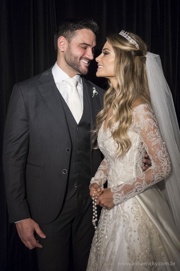 the bride and groom are posing for a photo