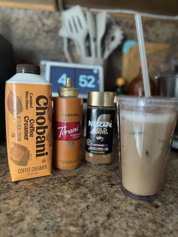 some coffee drinks are sitting on the counter