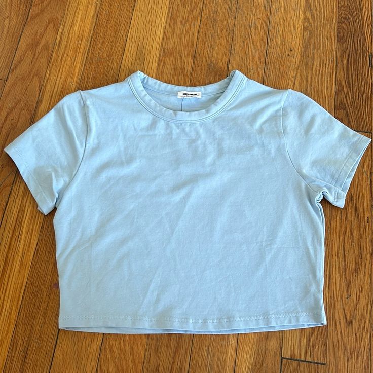 Never Worn! In Perfect Condition. Basic Plain Cotton Crop Top, Basic Light Wash Cotton Tops, Plain Cotton Crop Top For Spring, Trendy Light Blue Crew Neck Crop Top, Basic Blue Summer Tops, Basic Blue Tops For Spring, Basic Blue Tops For Summer, Blue Cotton Tops For Everyday Wear, Light Blue Stretch Basic Top