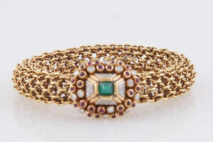 For Sale on 1stDibs - Unique bracelet finely crafted in 18K Yellow Gold with beautiful clasp, centering sugarloaf Emerald, surrounded by cabochon Rubies and diamonds. Signed Luxury Yellow Gold Cabochon Bracelets, Luxury Yellow Gold Bracelets With Cabochon, Yellow Gold Cabochon Bracelets For Weddings, Luxury Jeweled Yellow Gold Bracelets, Luxury Cabochon Bracelets For Wedding, Luxury Wedding Bracelet With Cabochon, Luxury Diamond Jeweled Bracelets, Elegant Jeweled Yellow Gold Bracelet, Jeweled Bracelets For Formal Occasions