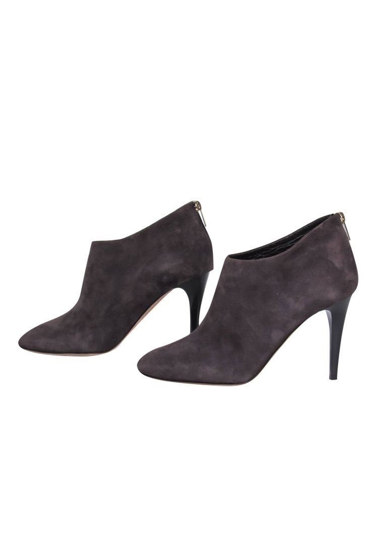 Step out in suede with these luxe boots from Jimmy Choo! The classic bootie is elevated (literally!) with a skinny heel and buttery soft suede design. Perfect for a night out during those crisp months. Pair with a sleek sweater dress and leather jacket for a luxe look that's sure to heat up the cold! Size 10 (EU 40) Suede upper Back zipper closure Round toe Skinny heel Leather sole and footbed w/ some wear Heel 4" Suede Ankle Boots With 4-inch Heel, Fall Suede Boots With 4-inch Heel, Sleek Suede Boots For Fall, Elegant Suede Heeled Boots With 4-inch Heel, Suede High Heel Work Boots, Chic 4-inch Heeled Suede Boots, Chic 4-inch Heel Suede Boots, Ankle-high Suede Heels For Work, Suede Ankle-high Heels For Work