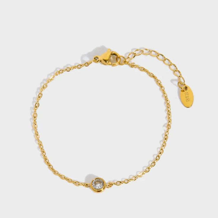 Embrace understated elegance with our "Kendall Bracelet." This delicate and dainty piece features a single diamond on a slender chain, exuding a timeless beauty that is both pretty and refined. Perfect for everyday wear or special occasions, this bracelet effortlessly adds a touch of subtle sparkle and sophistication to any outfit. Nickel, lead, alloy, brass free Hypoallergenic Waterproof Anti-tarnish 10 inches Jewelry Care Sterling Silver To make the most out of your newest addition, we recomme Classic Adjustable Bracelet With Delicate Chain, Elegant Diamond Bracelet With Delicate Adjustable Chain, Delicate Cubic Zirconia Bracelet With Adjustable Chain, Classic Adjustable Gold Bracelet With Delicate Chain, Adjustable Diamond Bracelet With Delicate Chain, Adjustable Cubic Zirconia Bracelet With Delicate Chain, Adjustable Delicate Chain Bracelet With Cubic Zirconia, Adjustable Delicate Cubic Zirconia Chain Bracelet, Minimalist Gold Diamond Chain Bracelet